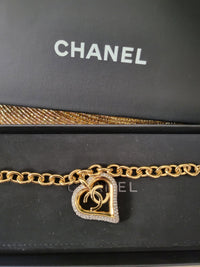 Close-up of the Chanel CC heart charm with crystals